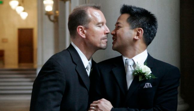 Same-sex couple Hata and Cadena share a private moment after their wedding ceremony in San Francisco